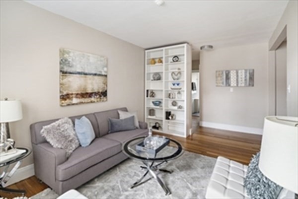 52 Strathmore Road, Unit 25 Boston, MA 02135 - Photo 2 of 12 a living room with furniture and a wooden floor