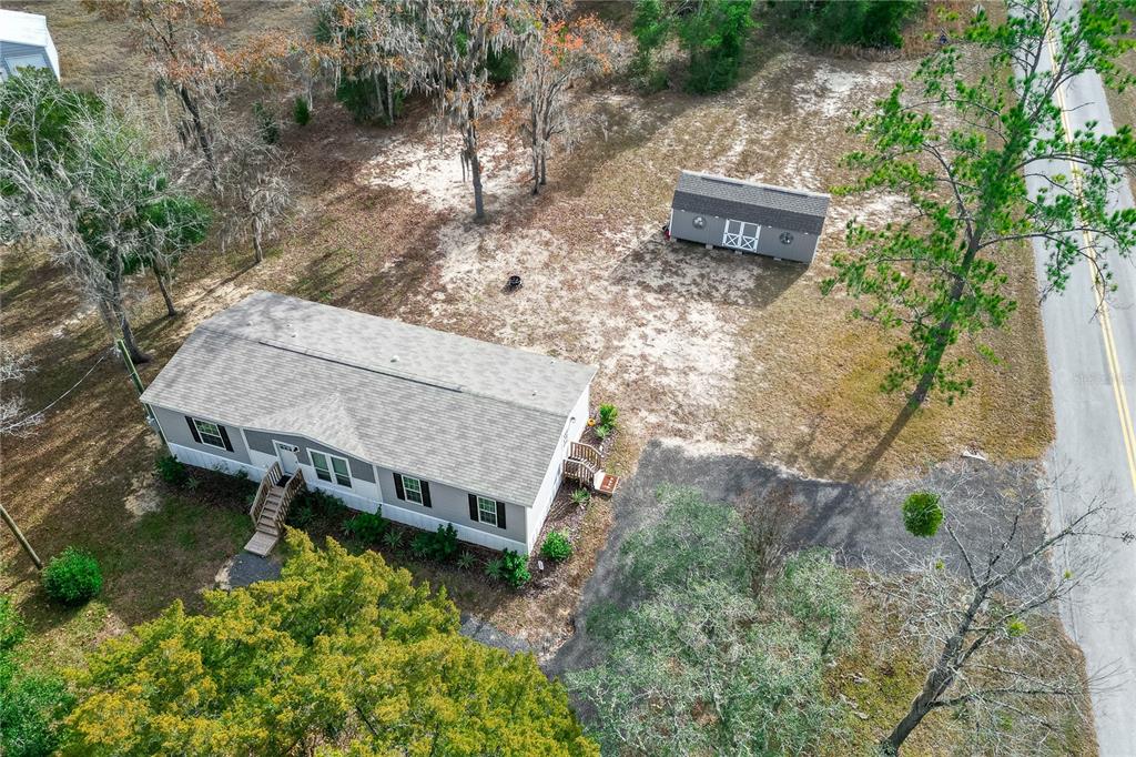 10850 Northeast 110th Lane Archer, FL 32618 - Photo 21 of 24 an aerial view of a house with a yard and a fountain