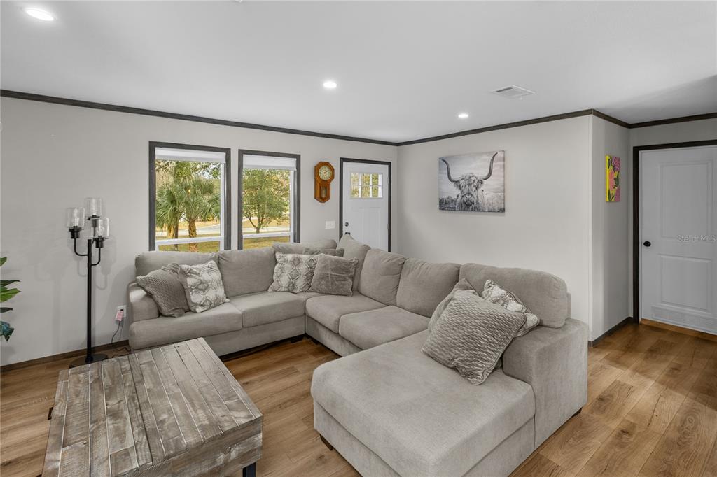 10850 Northeast 110th Lane Archer, FL 32618 - Photo 3 of 24 a living room with furniture and a large window