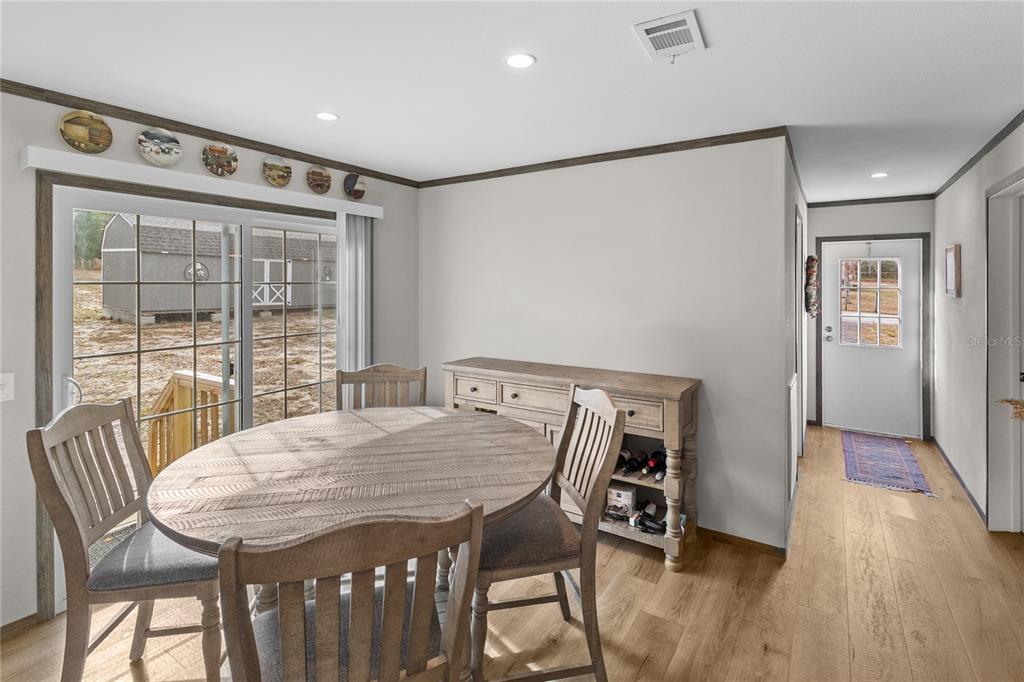 10850 Northeast 110th Lane Archer, FL 32618 - Photo 6 of 24 a view of a dining room with furniture window and wooden floor