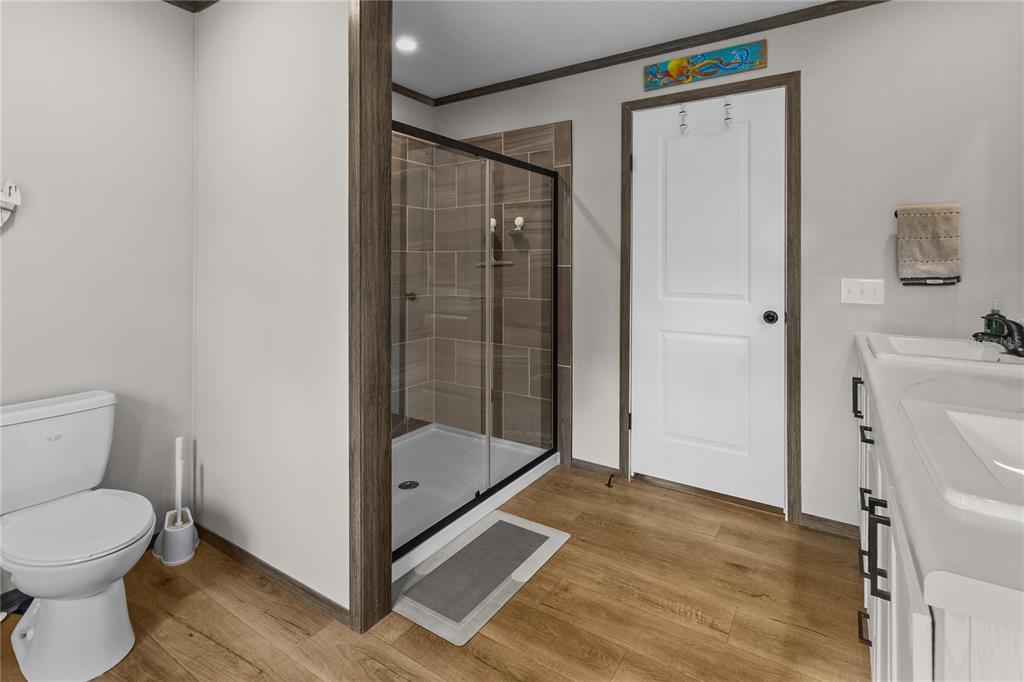 10850 Northeast 110th Lane Archer, FL 32618 - Photo 10 of 24 a bathroom with a toilet and a shower