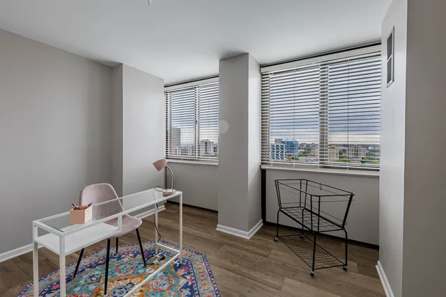 a workspace with furniture and a window