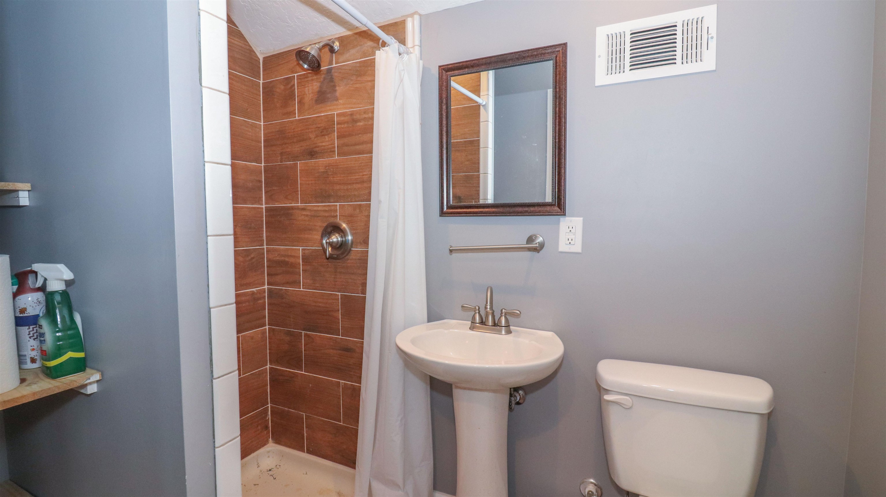 4405 Old Friendship Road Finger, TN 38334 - Photo 38 of 38 a bathroom with a sink toilet and shower