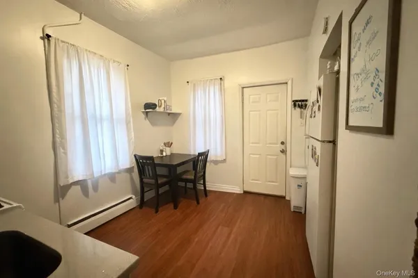 a view of a livingroom with furniture and wooden floor