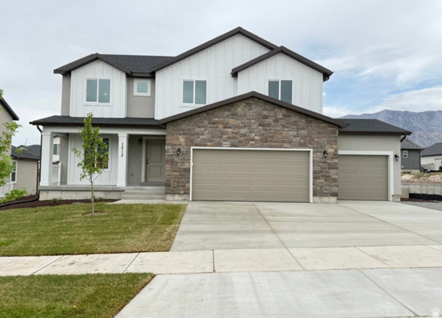 Contemporary two-story residence featuring a stone and stucco façade
