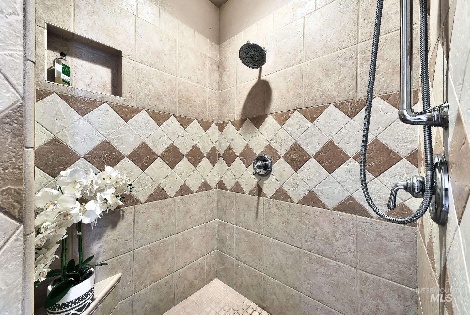 19288 Majestic View Place Caldwell, ID 83607 - Photo 20 of 50 Walk in shower featuring fully tiled shower and dual heads