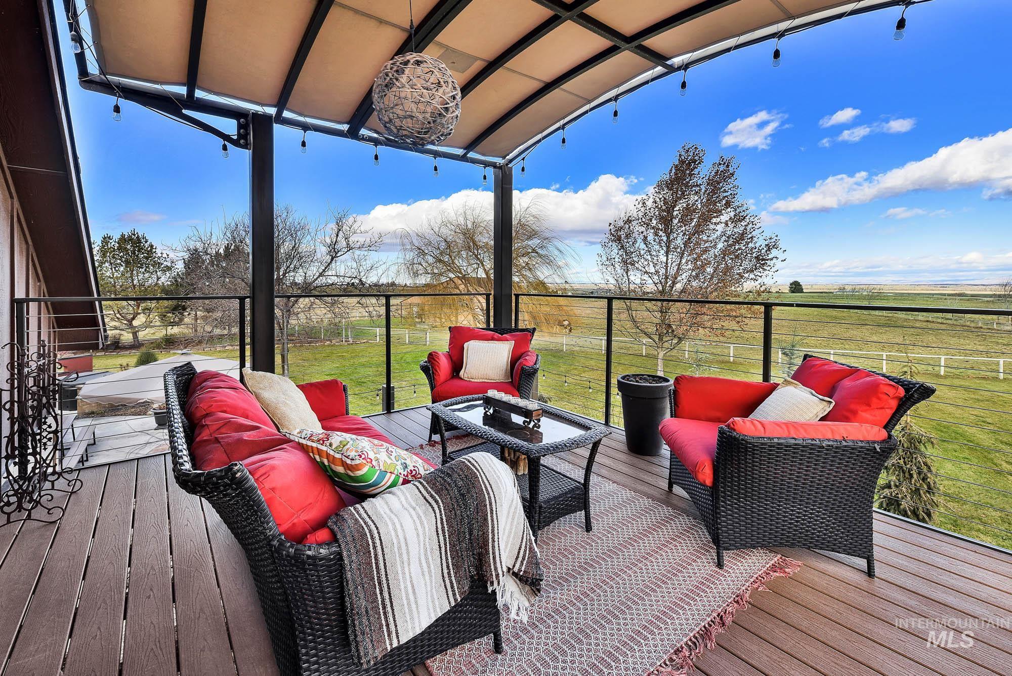 19288 Majestic View Place Caldwell, ID 83607 - Photo 40 of 50 Deck with an outdoor gathering space and views of the yard and the mountains