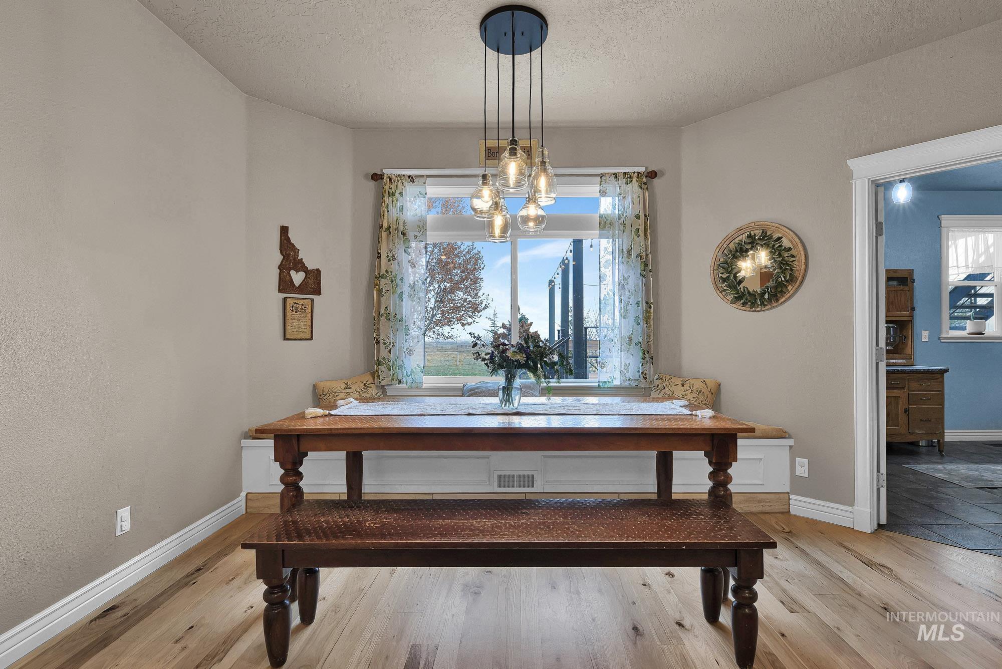 19288 Majestic View Place Caldwell, ID 83607 - Photo 9 of 50 Dining nook featuring light Maple flooring and a built in bench with storage