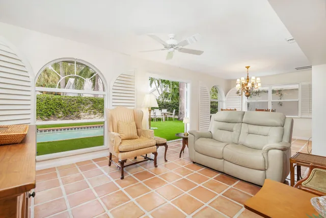 a view of a dining room with furniture and a window