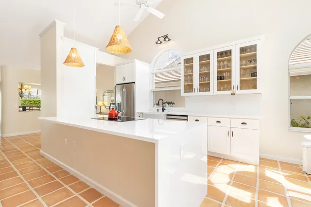 a bathroom with a double vanity sink a mirror and a shower