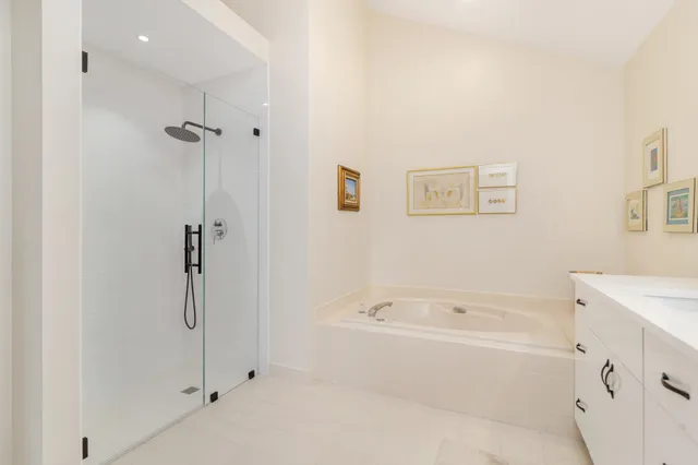 a bathroom with a granite countertop sink a mirror and a