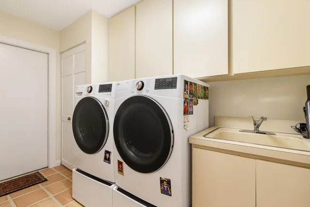a view of a house with a swimming pool and yard