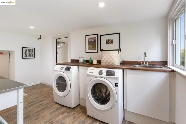 a balcony with wooden floor and outdoor seating