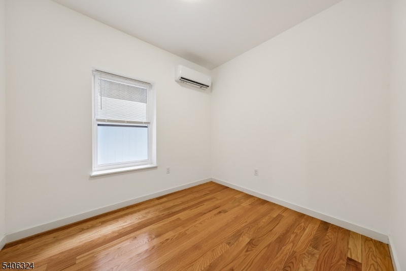52 James Street, Unit 1 Newark, NJ 07102 - Photo 12 of 28 an empty room with a window