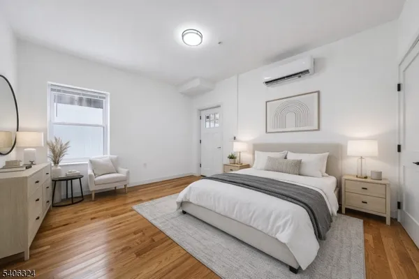 a bedroom with a bed and a couch