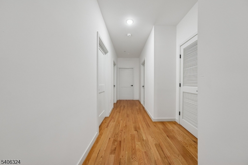 52 James Street, Unit 1 Newark, NJ 07102 - Photo 18 of 28 a view of a bedroom with wooden floor
