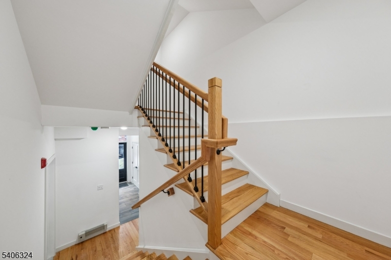 52 James Street, Unit 1 Newark, NJ 07102 - Photo 22 of 28 a view of entryway and hall with wooden floor