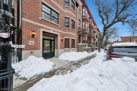 a view of a house with snow in the yard