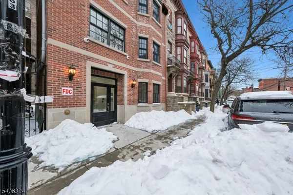 a view of a house with snow in the yard