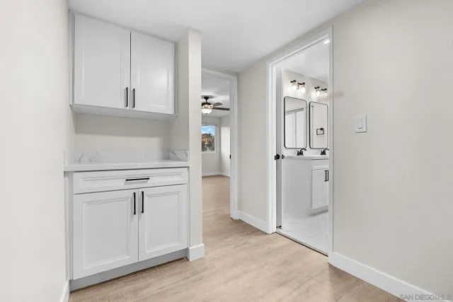 a view of cabinets and wooden floor