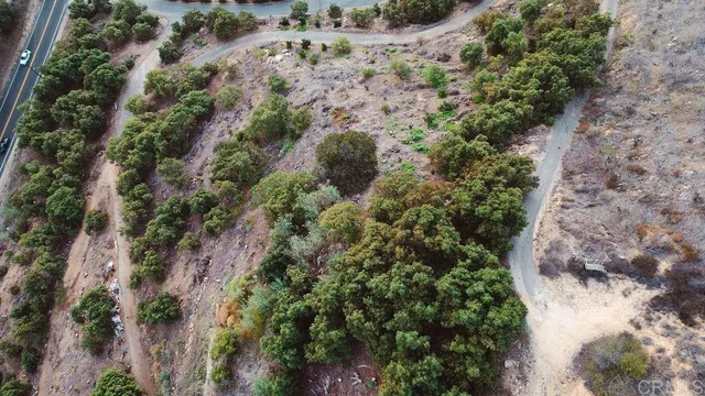 a view of a mountain in the distance in a field