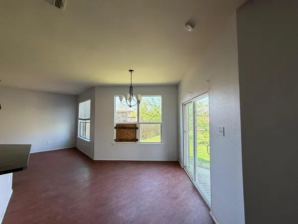a kitchen with cabinets a sink and a stove