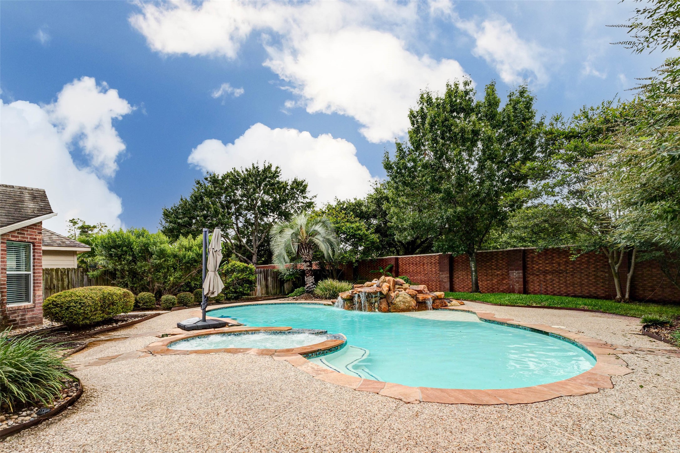 6334 Sampras Ace Court Spring, TX 77379 - Photo 43 of 48 Just around the corner from the door is this amazing pool. Imagine how awesome a staycation would be here!!
