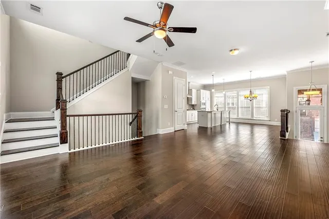 a view of an entryway with wooden floor