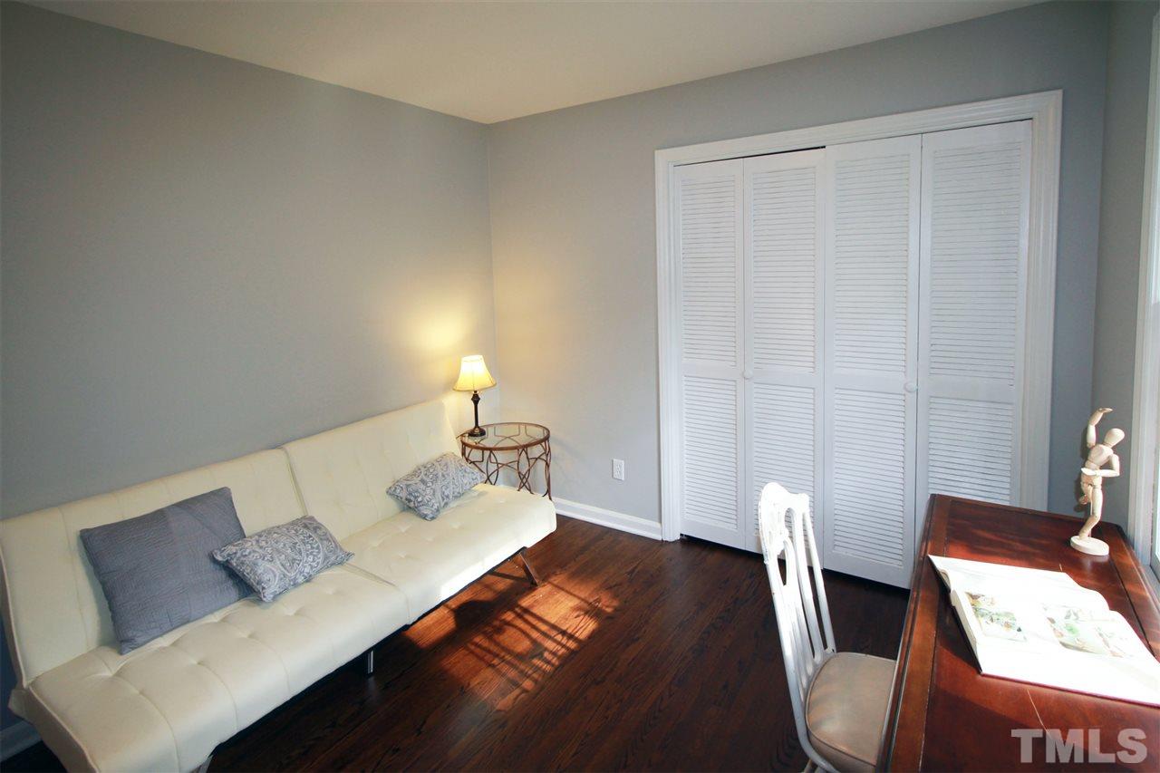 308 Lord Berkley Road Raleigh, NC 27610 - Photo 22 of 25 a view of a workspace with furniture and wooden floor
