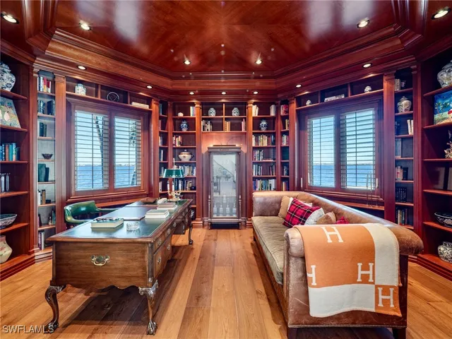 a bed room with furniture and a chandelier