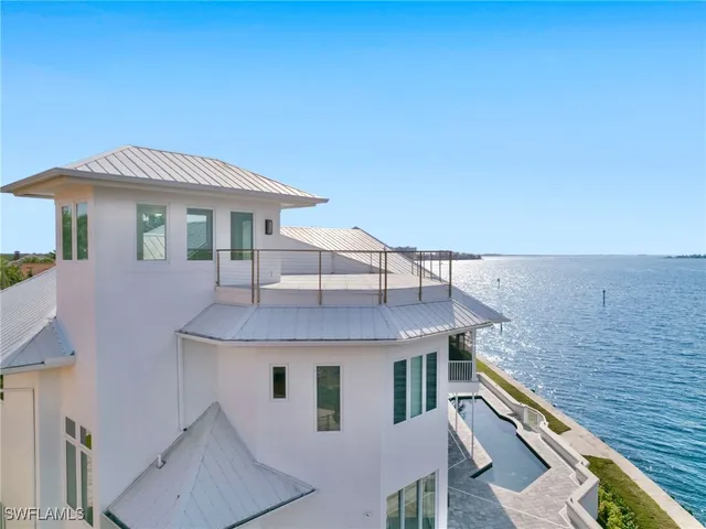 a view of a terrace with a table and chairs
