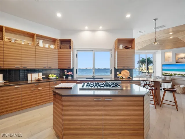 a kitchen with stainless steel appliances granite countertop a stove and a sink