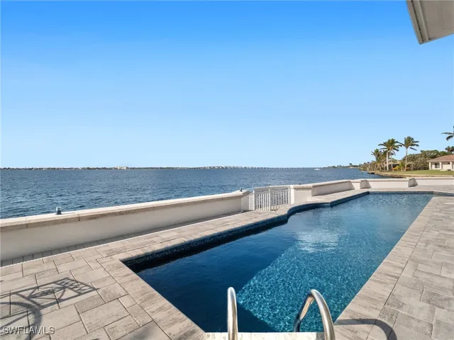 a view of a room with kitchen island and wooden floor