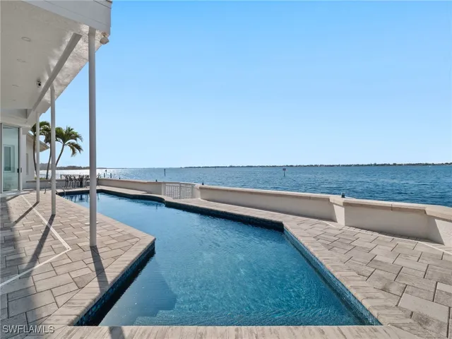 a view of a living room and kitchen