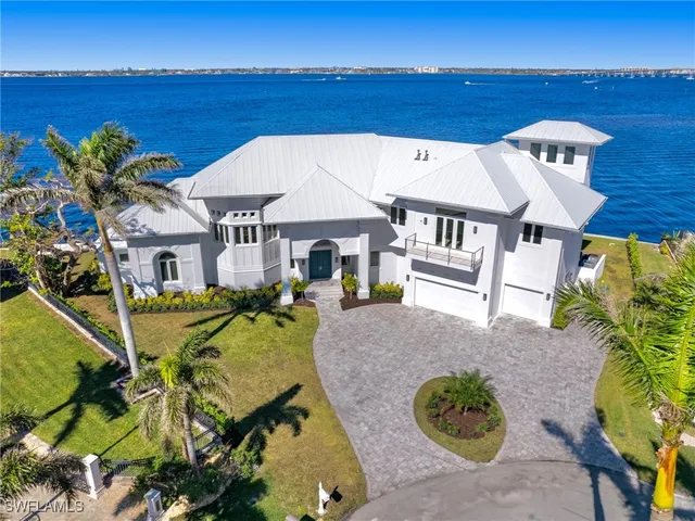 a aerial view of a house with table and chairs