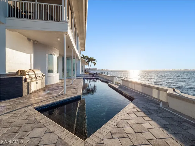 a view of a living room and kitchen