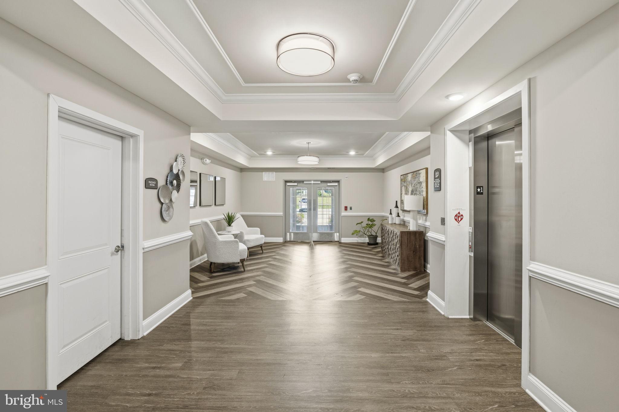 401 Bold Ruler Court, Unit 307 Havre de Grace, MD 21078 - Photo 3 of 32 Building entrance w/ seating area & elevator