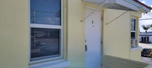 a view of hallway with wooden floor