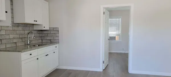 a view of cabinets and window