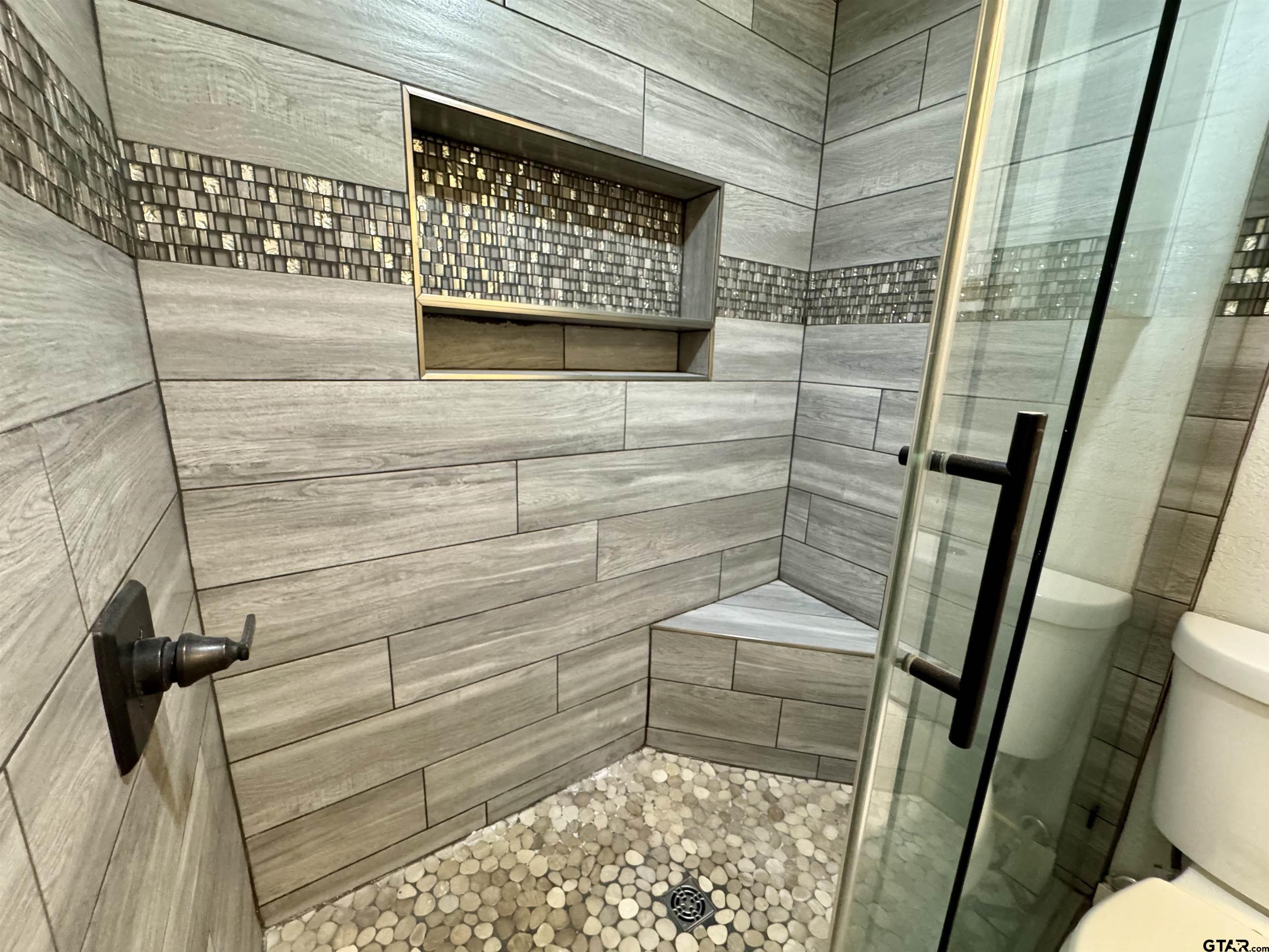 403 East Henderson Street Overton, TX 75684 - Photo 16 of 31 a bathroom with a sink and toilet