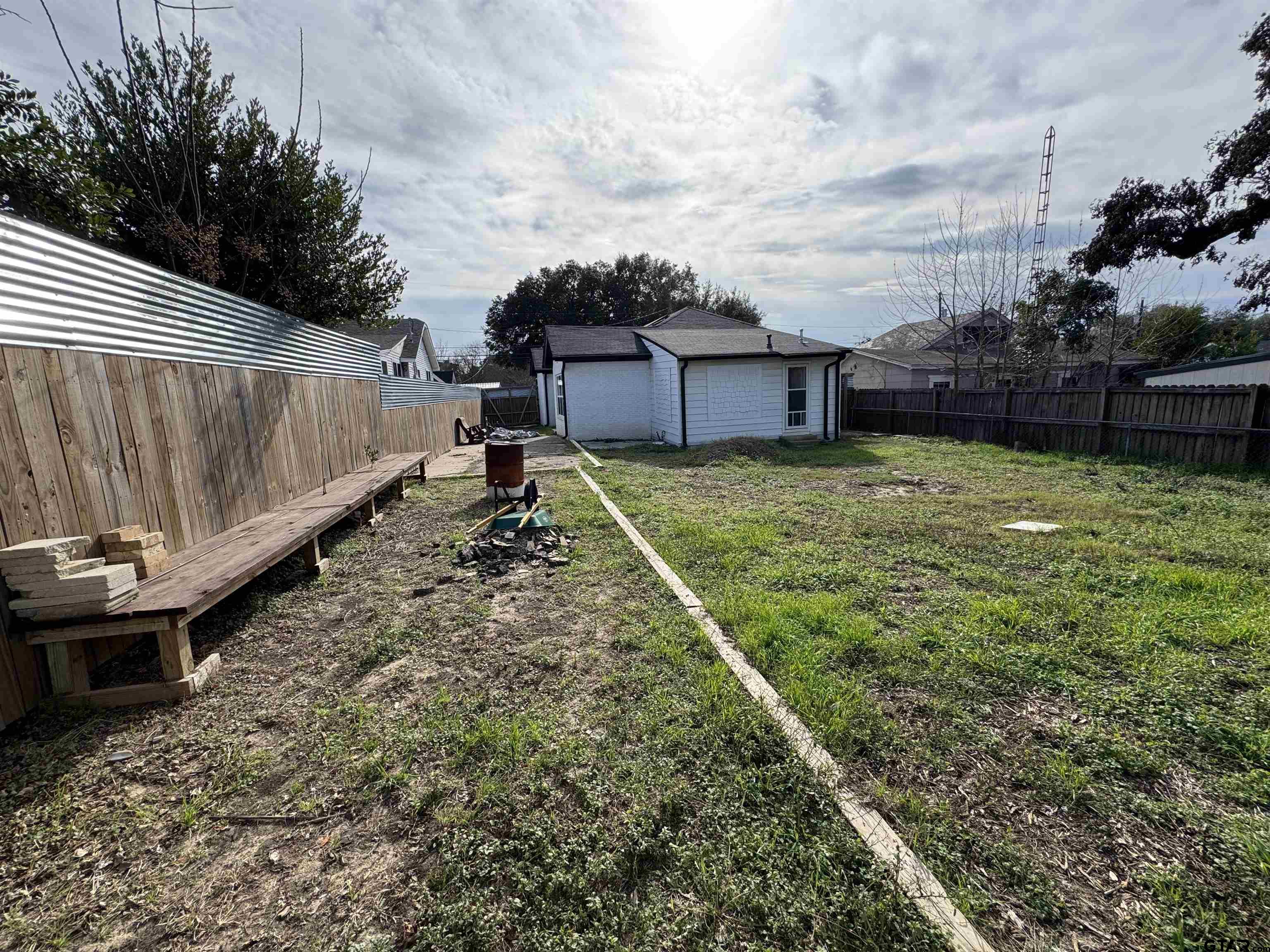 403 East Henderson Street Overton, TX 75684 - Photo 22 of 31 a backyard of a house with lots of green space