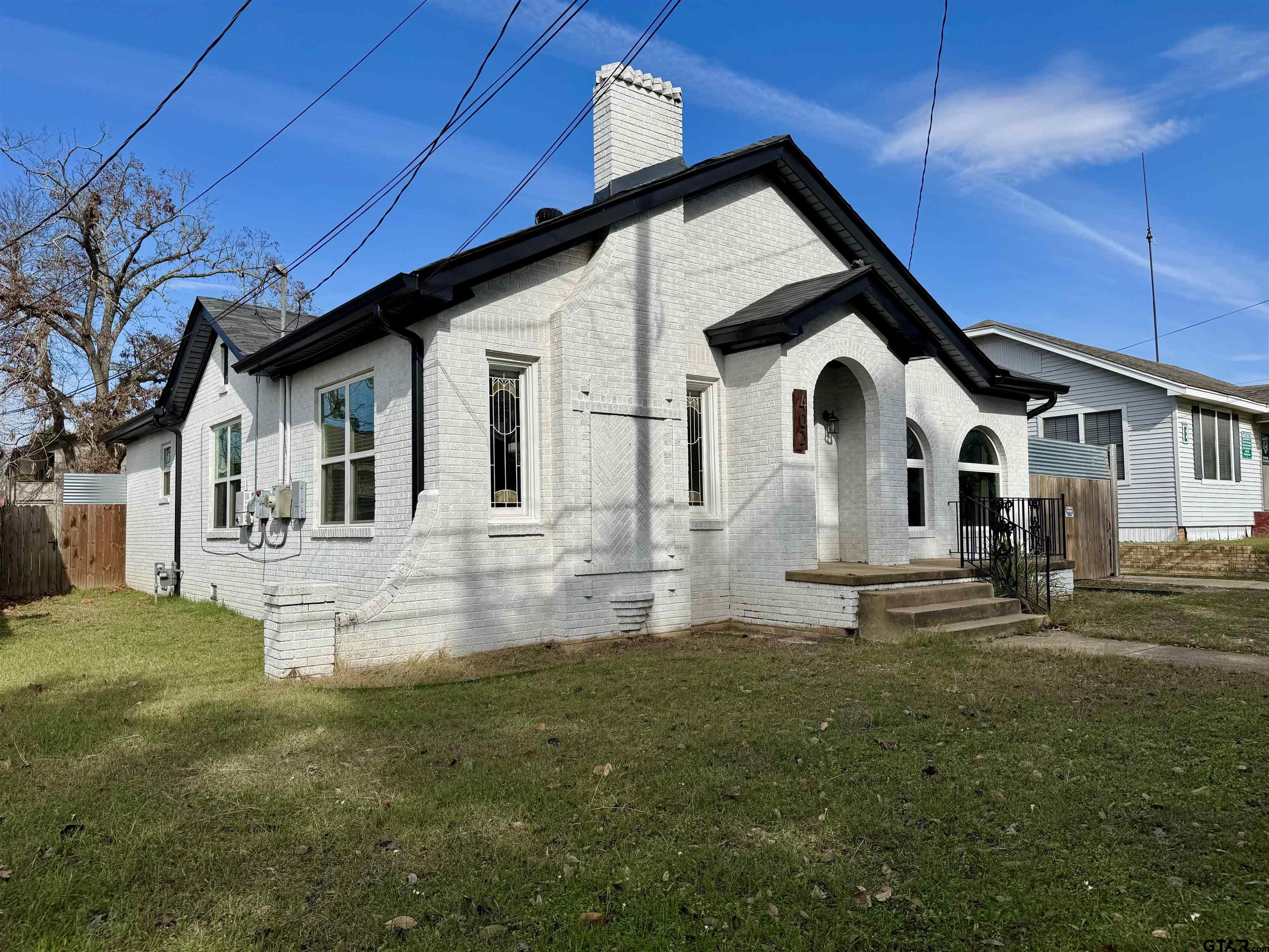 403 East Henderson Street Overton, TX 75684 - Photo 27 of 31 a front view of a house with a yard