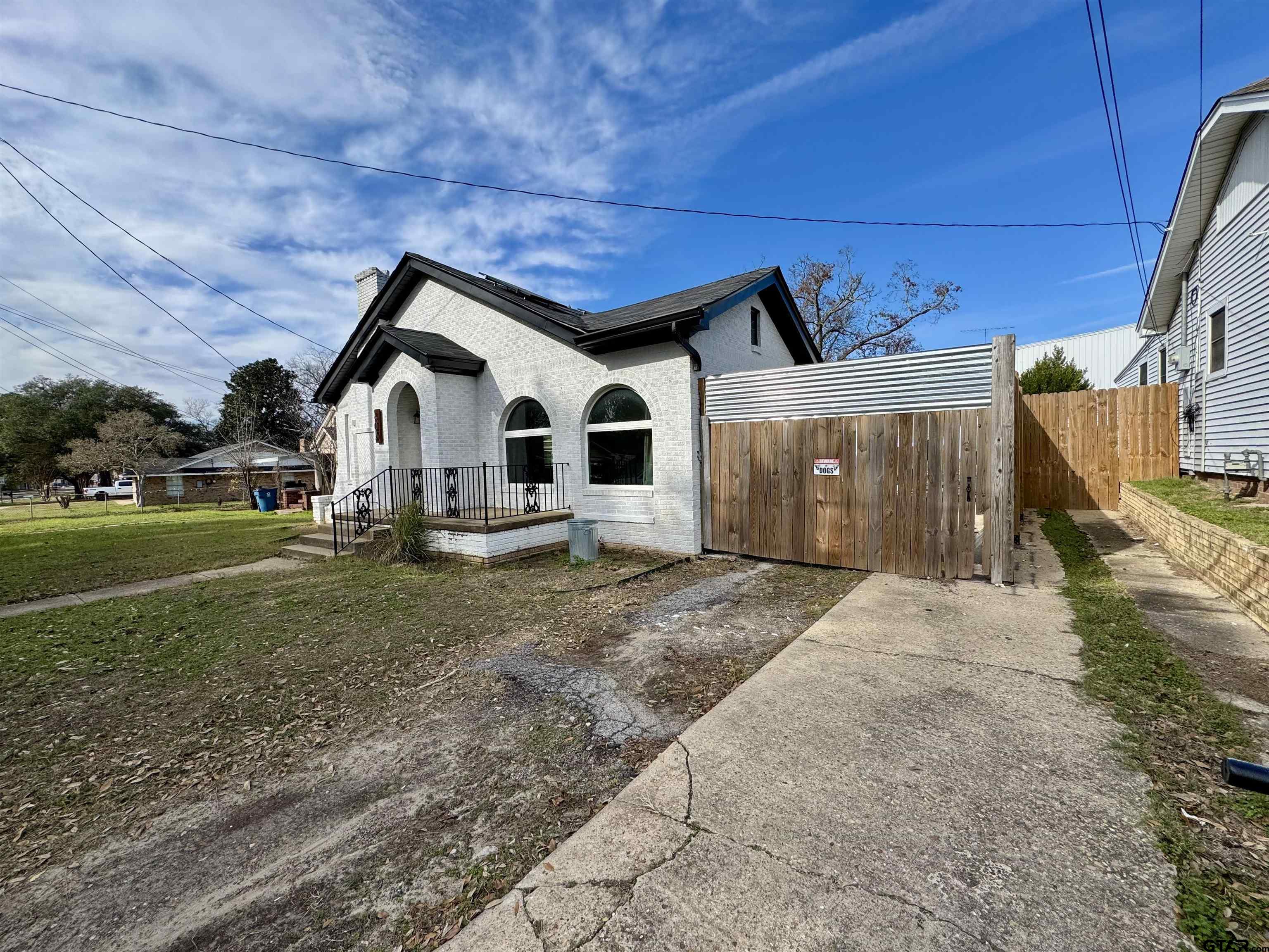 403 East Henderson Street Overton, TX 75684 - Photo 28 of 31 a view of a white house with a yard