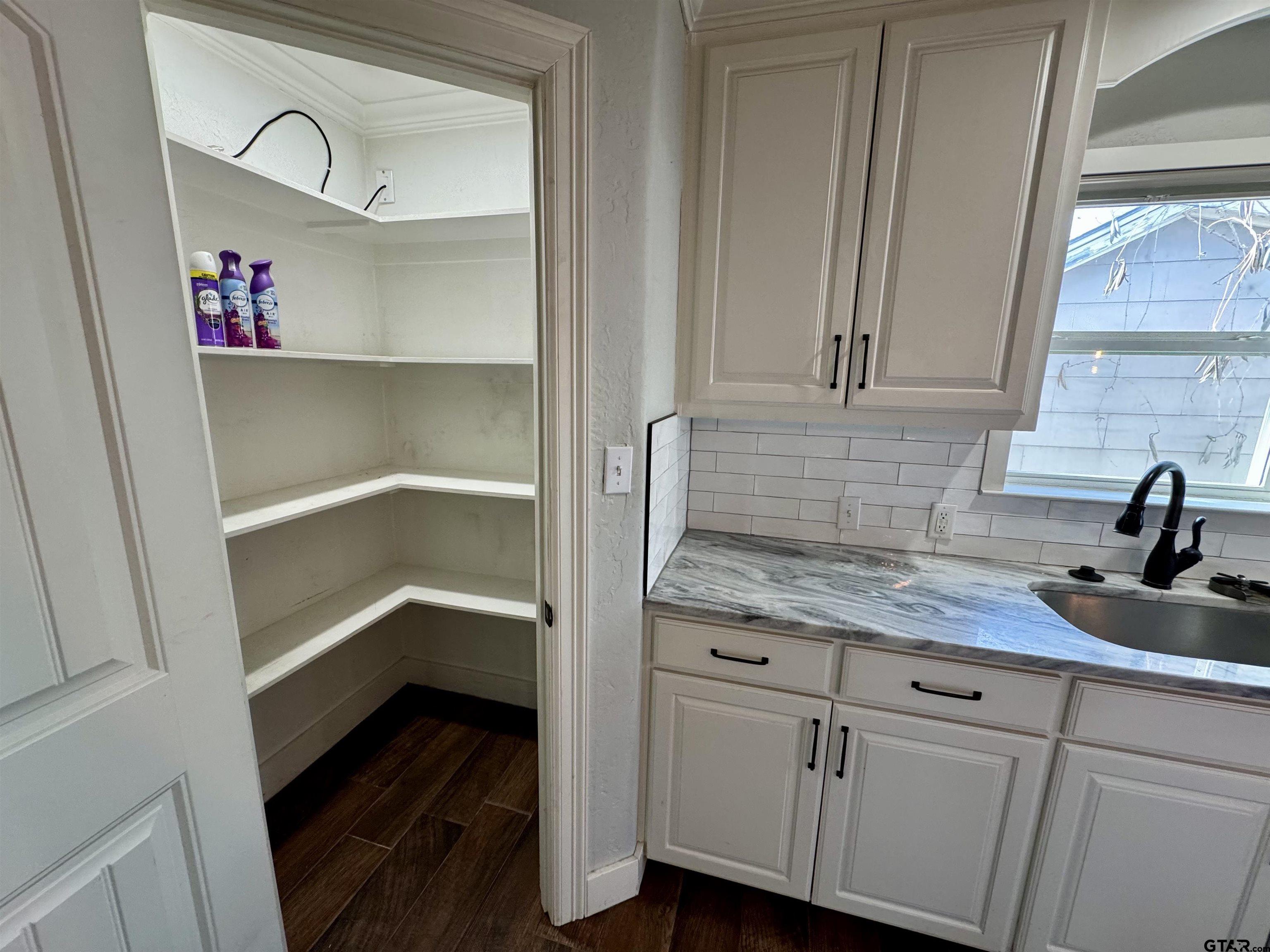 403 East Henderson Street Overton, TX 75684 - Photo 31 of 31 a kitchen with a sink and cabinets