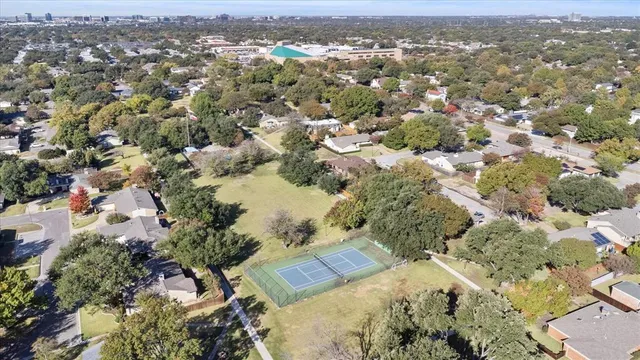 an aerial view of a house with a yard