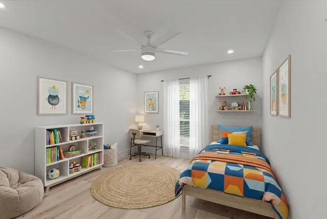 a bedroom with a bed and a wooden floor