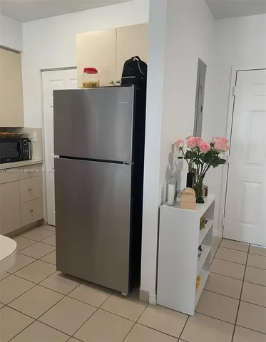 a white refrigerator freezer sitting in a kitchen