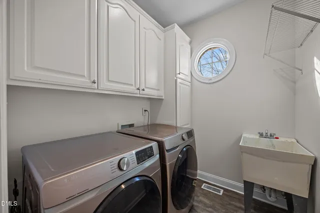 a view of a dining room with furniture wooden floor and chandelier