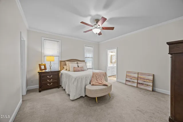 a spacious bedroom with a bed and window