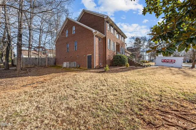 a front view of a house with yard outdoor seating and barbeque oven